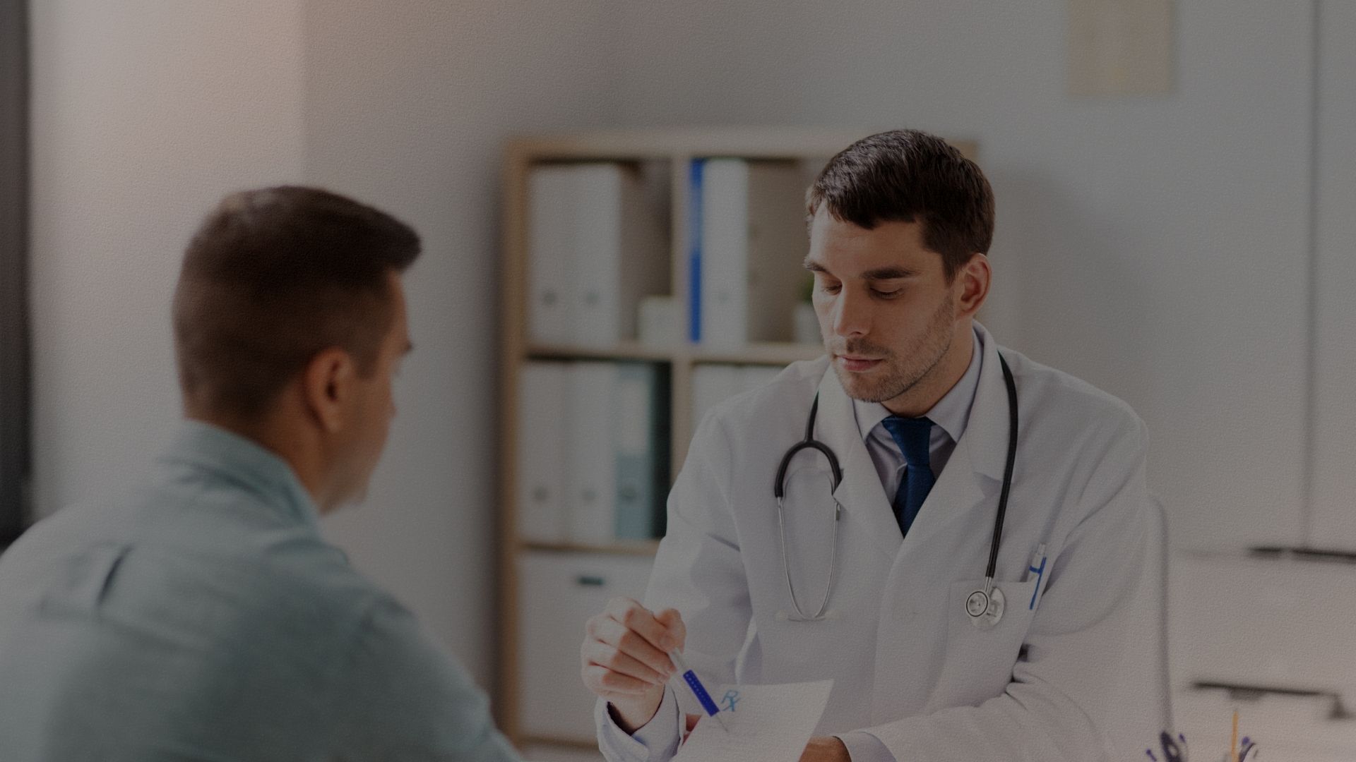 Doctor consulting with a patient in a caring clinical setting